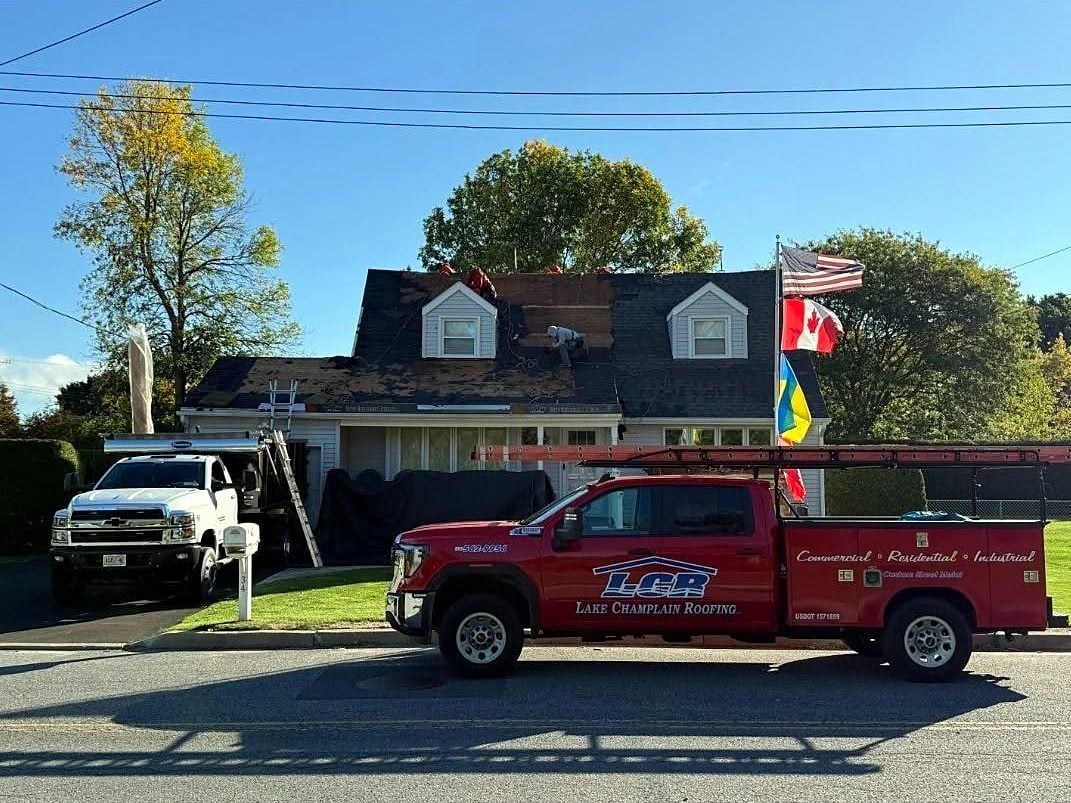 Crew trucks at a residential re-roof